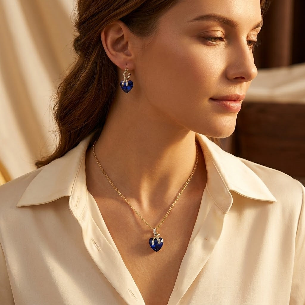 Set de bijoux : collier et boucles d'oreilles en or avec cœur en saphir