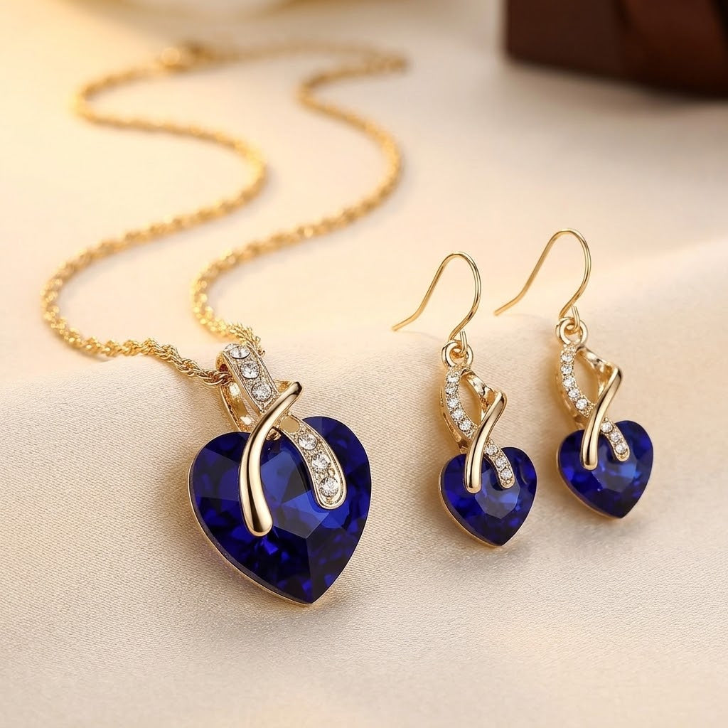 Set de bijoux : collier et boucles d'oreilles en or avec cœur en saphir