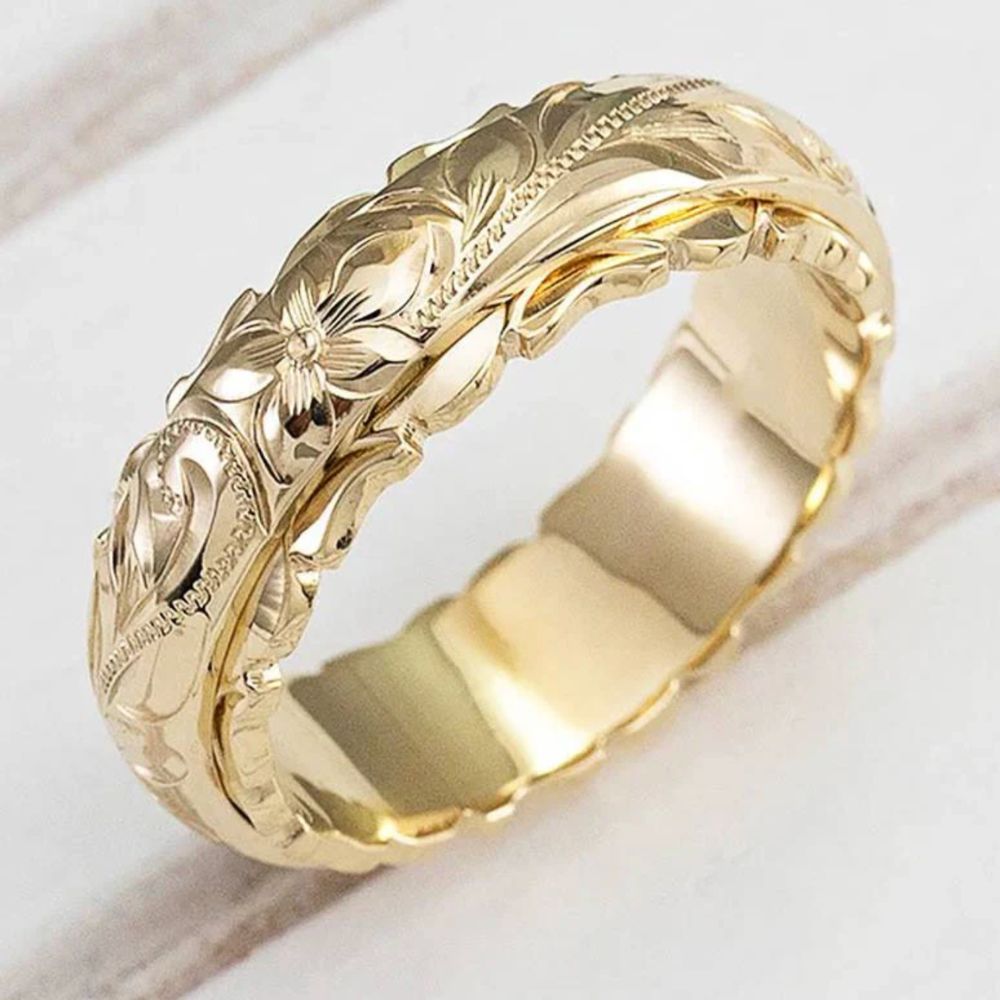 Bague vintage en or ornée de fleurs